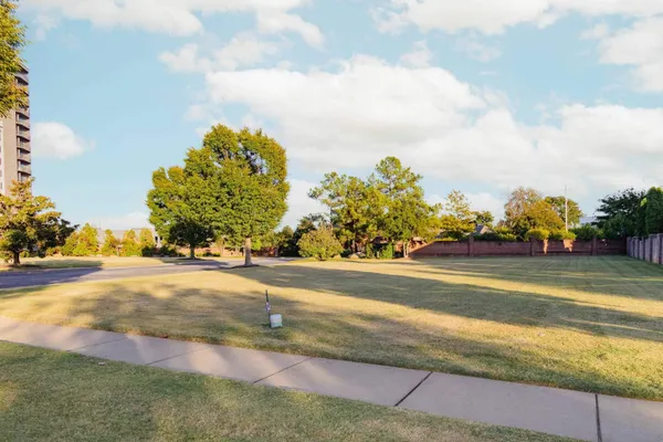 a view of a playground with basketball court