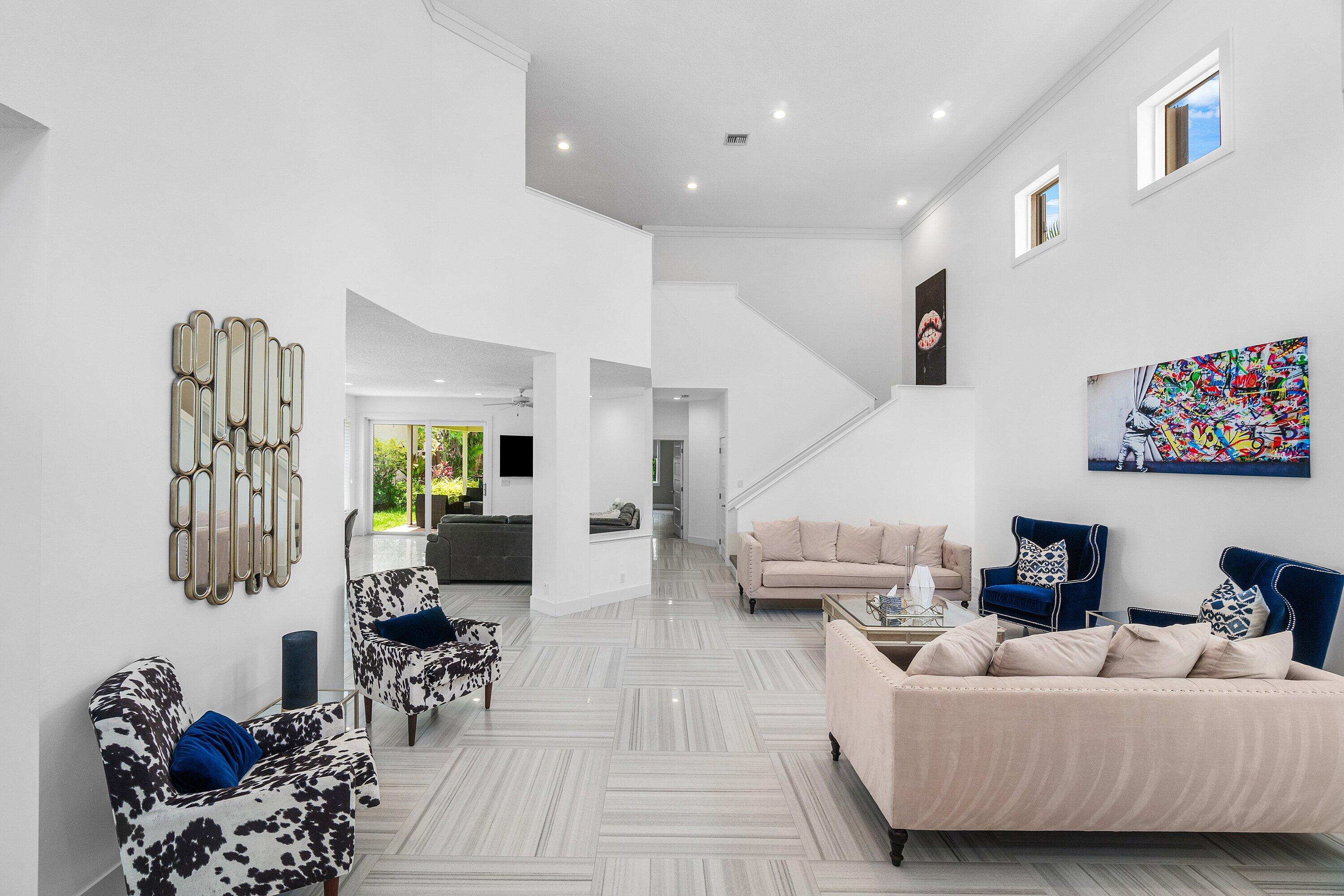 2404 Northwest 67th Street Boca Raton, FL 33496 - Photo 3 of 74 a living room with furniture and a couch