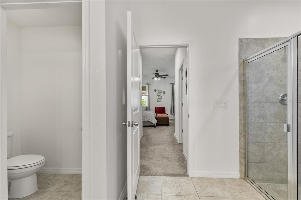 5637 Beggs Road St. Cloud, FL 34771 - Photo 20 of 35 a en suite bathroom with a toilet