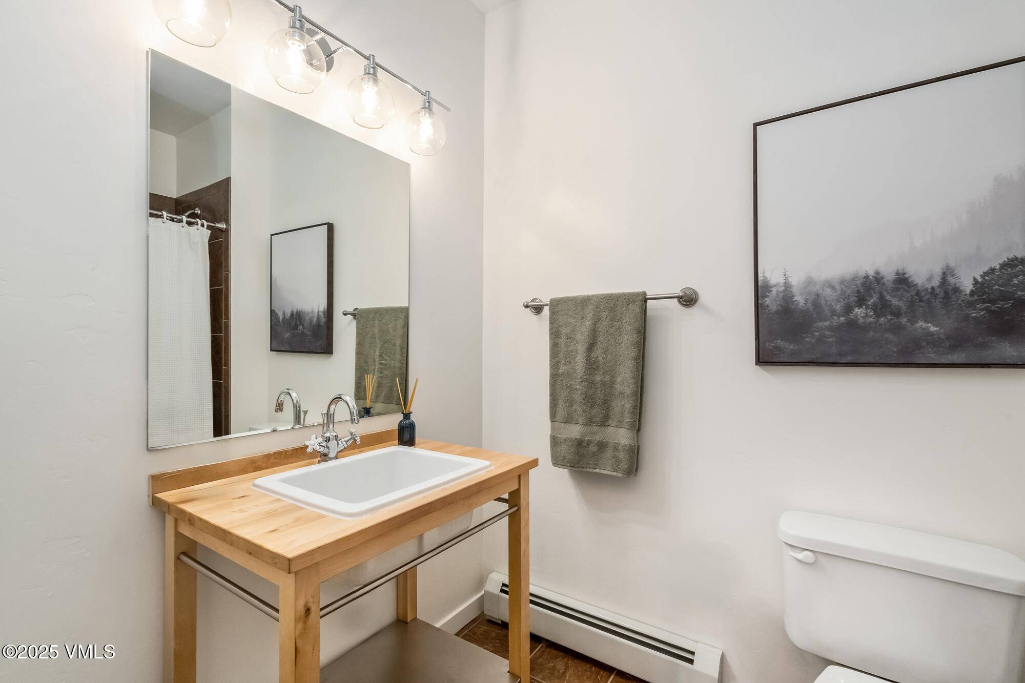705 Nogal Road, Unit A8 Eagle, CO 81631 - Photo 16 of 33 a bathroom with a sink a toilet and mirror