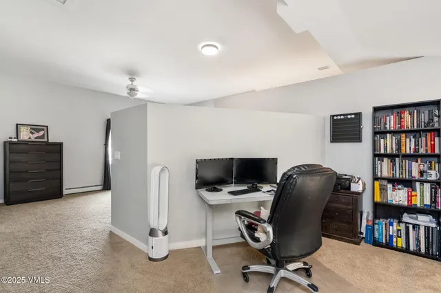 a view of a workspace with furniture