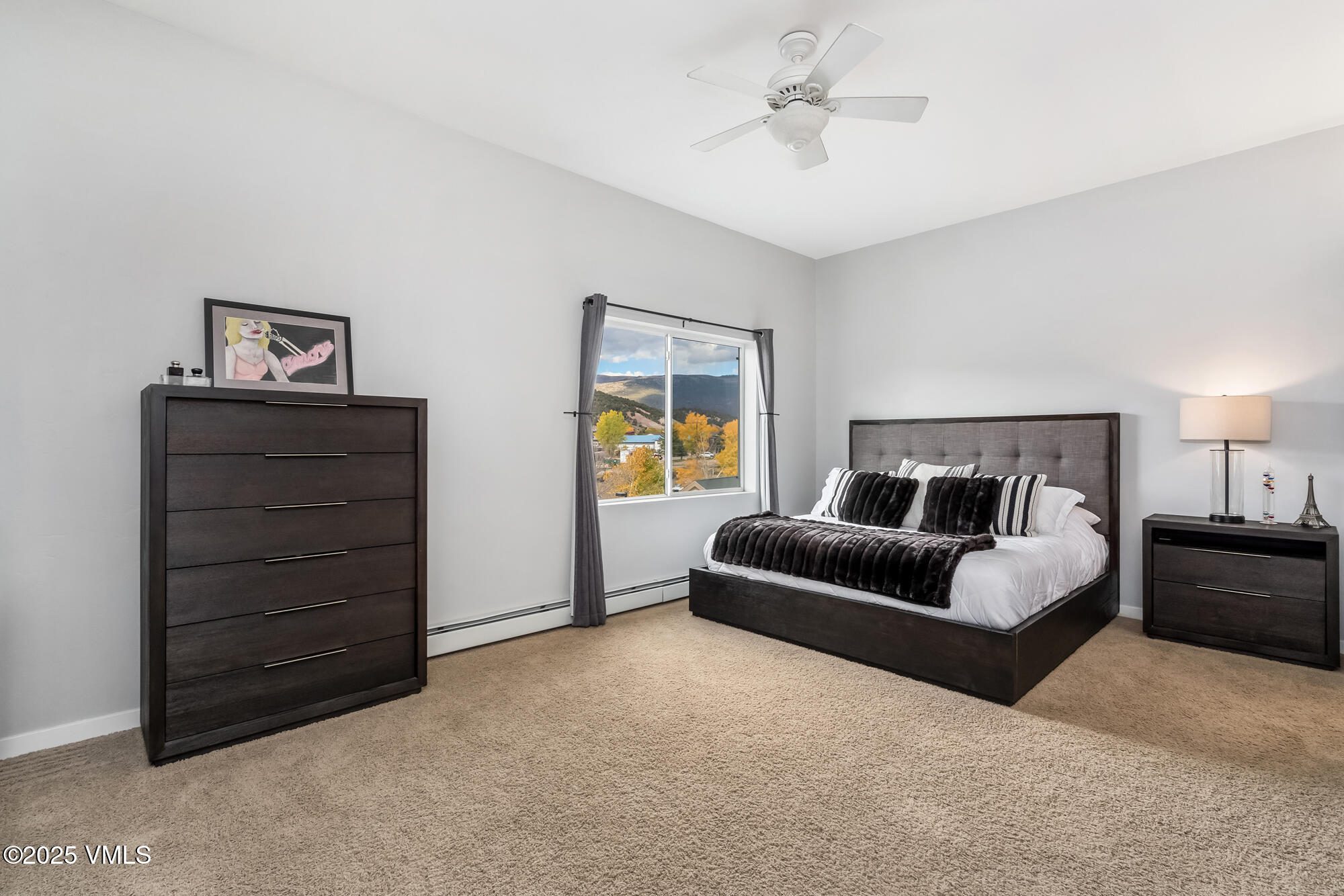 705 Nogal Road, Unit A8 Eagle, CO 81631 - Photo 21 of 33 a spacious bedroom with a bed and a dresser
