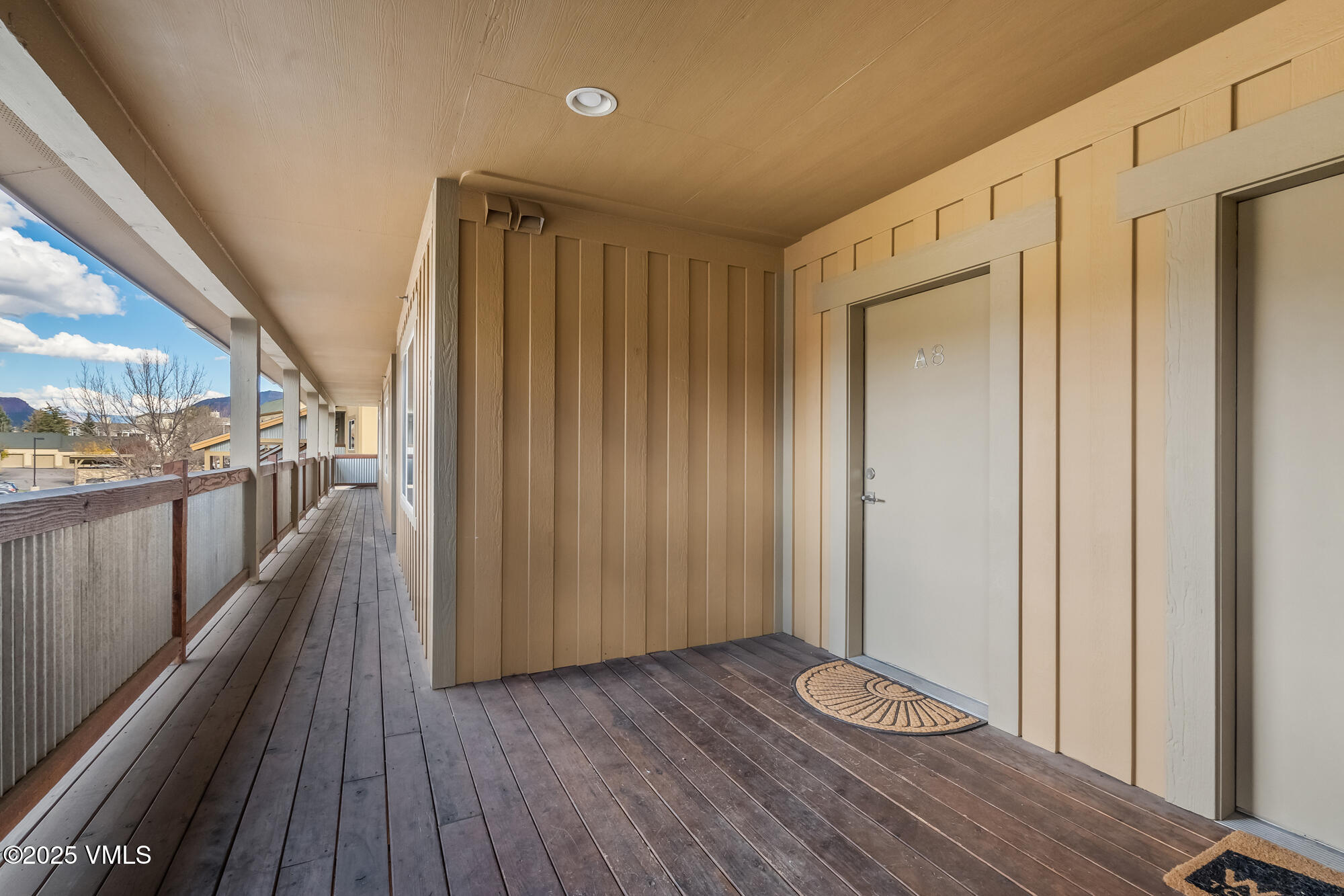 705 Nogal Road, Unit A8 Eagle, CO 81631 - Photo 24 of 33 a view of a hallway with wooden floor and staircase