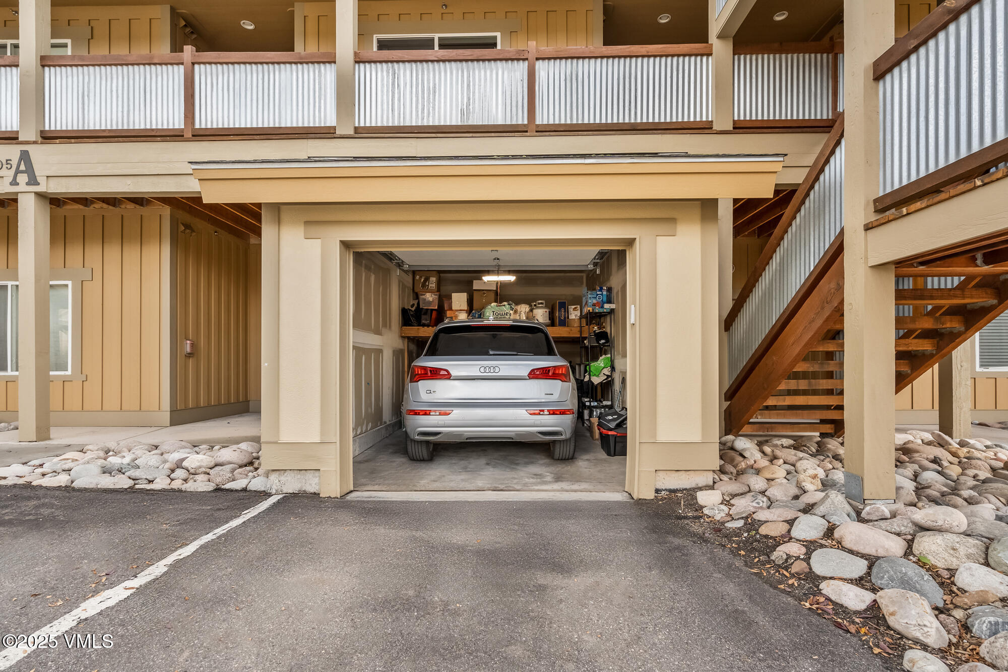 705 Nogal Road, Unit A8 Eagle, CO 81631 - Photo 26 of 33 a view of a livingroom with entryway and stairs