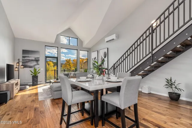 a view of a dining room with furniture window and wooden floor