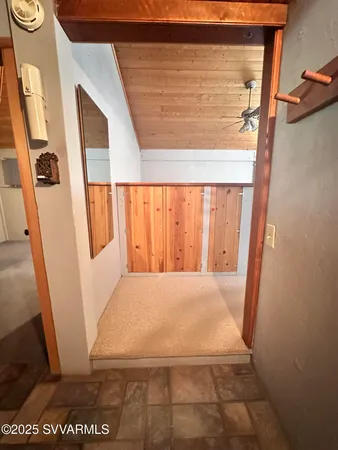 a view of a yard covered with snow in front of house