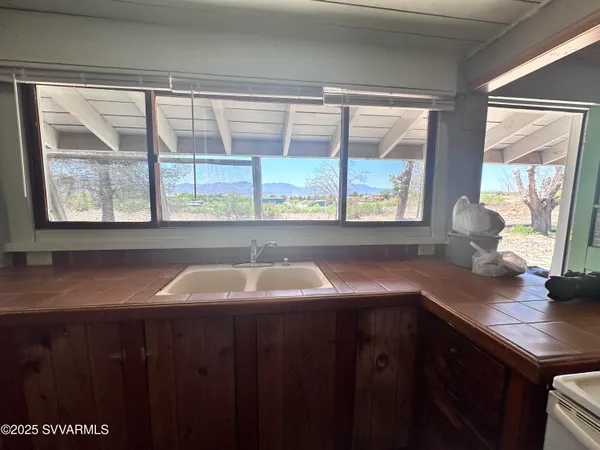 a room with a washing machine and a shower