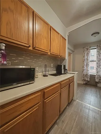 a kitchen with stainless steel appliances granite countertop a sink and cabinets