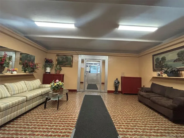 a view of a room with wooden floor and windows