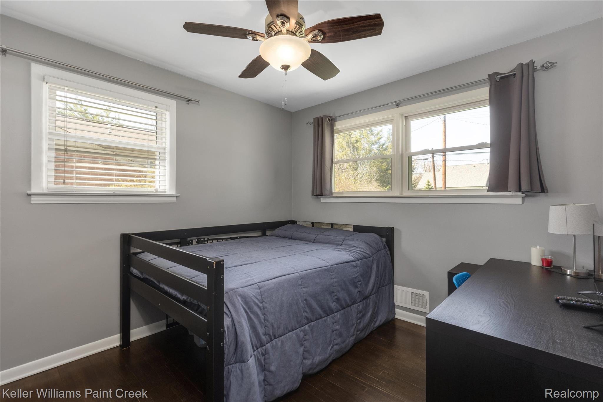 310 Elmhill Road Rochester, MI 48306 - Photo 16 of 37 Bedroom featuring dark wood finished floors, a ceiling fan, and multiple windows