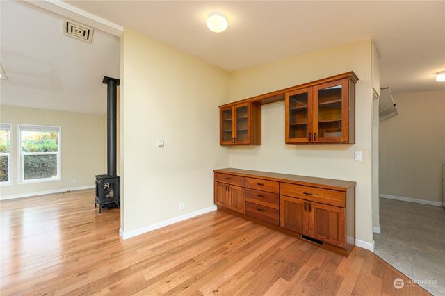 a room with wooden floor and window
