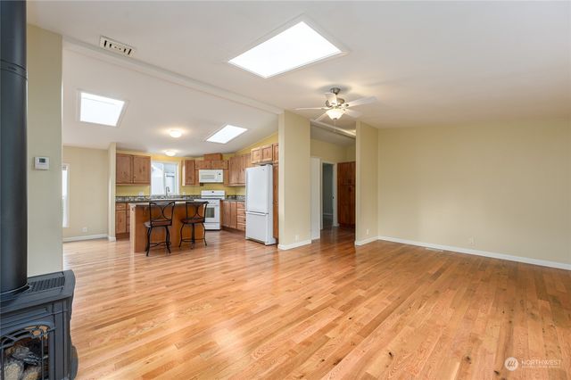 a view of a livingroom with furniture and a flat screen tv