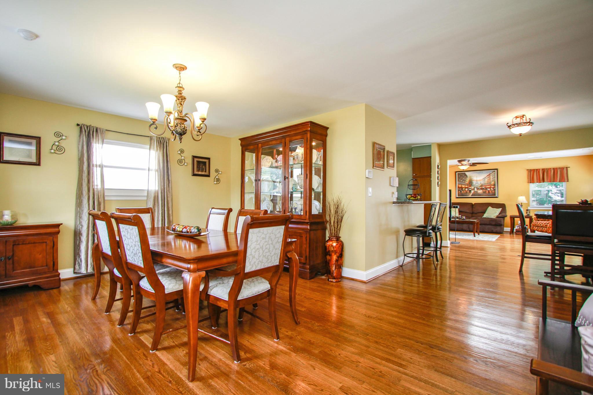 6202 Collinsway Road Baltimore, MD 21228 - Photo 1 of 30 a view of a dining room with furniture and wooden floor
