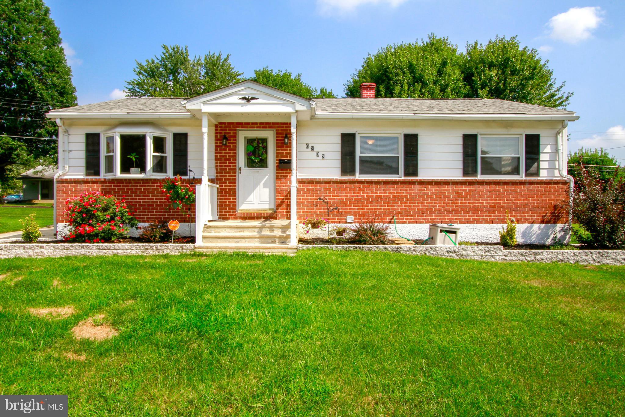 6202 Collinsway Road Baltimore, MD 21228 - Photo 2 of 30 a front view of a house with a yard