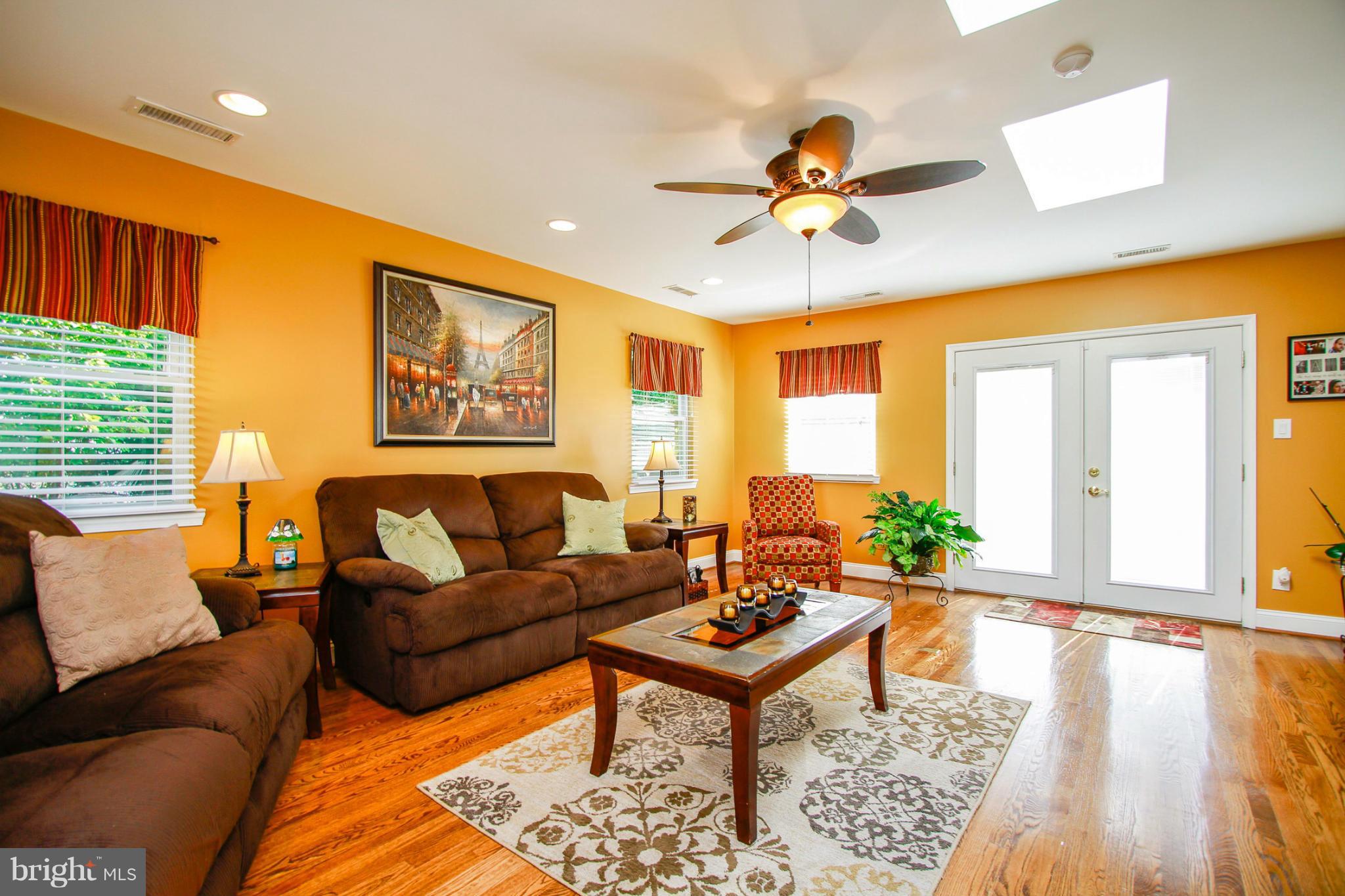 6202 Collinsway Road Baltimore, MD 21228 - Photo 11 of 30 a living room with furniture and a large window