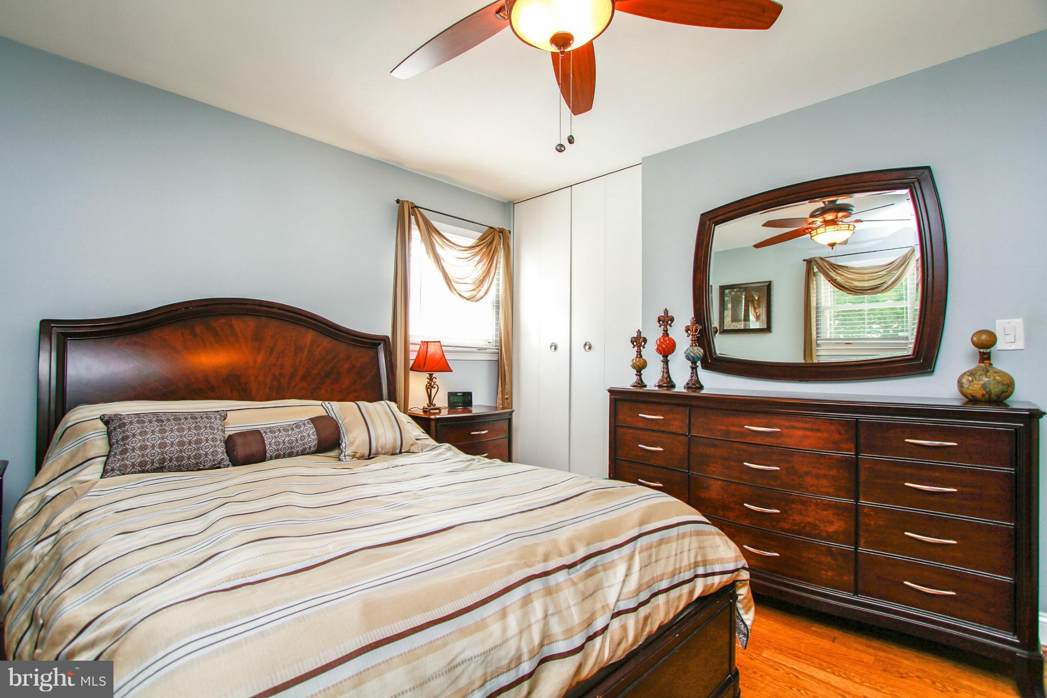 6202 Collinsway Road Baltimore, MD 21228 - Photo 12 of 30 a bedroom with a bed and a large dresser