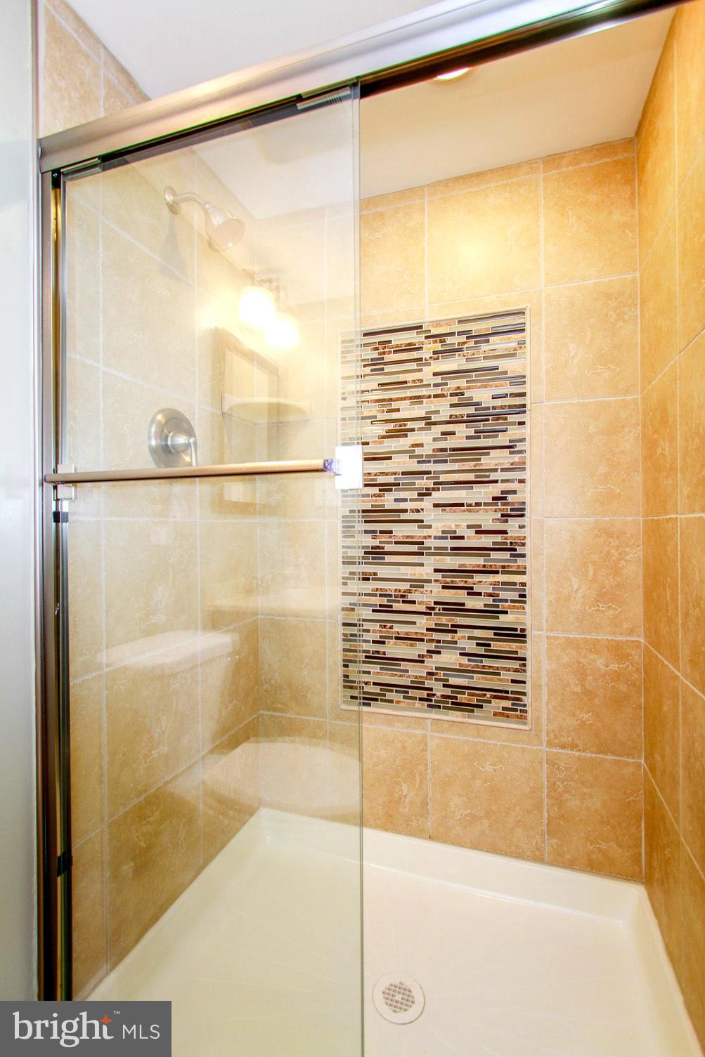 6202 Collinsway Road Baltimore, MD 21228 - Photo 25 of 30 a bathroom with a shower