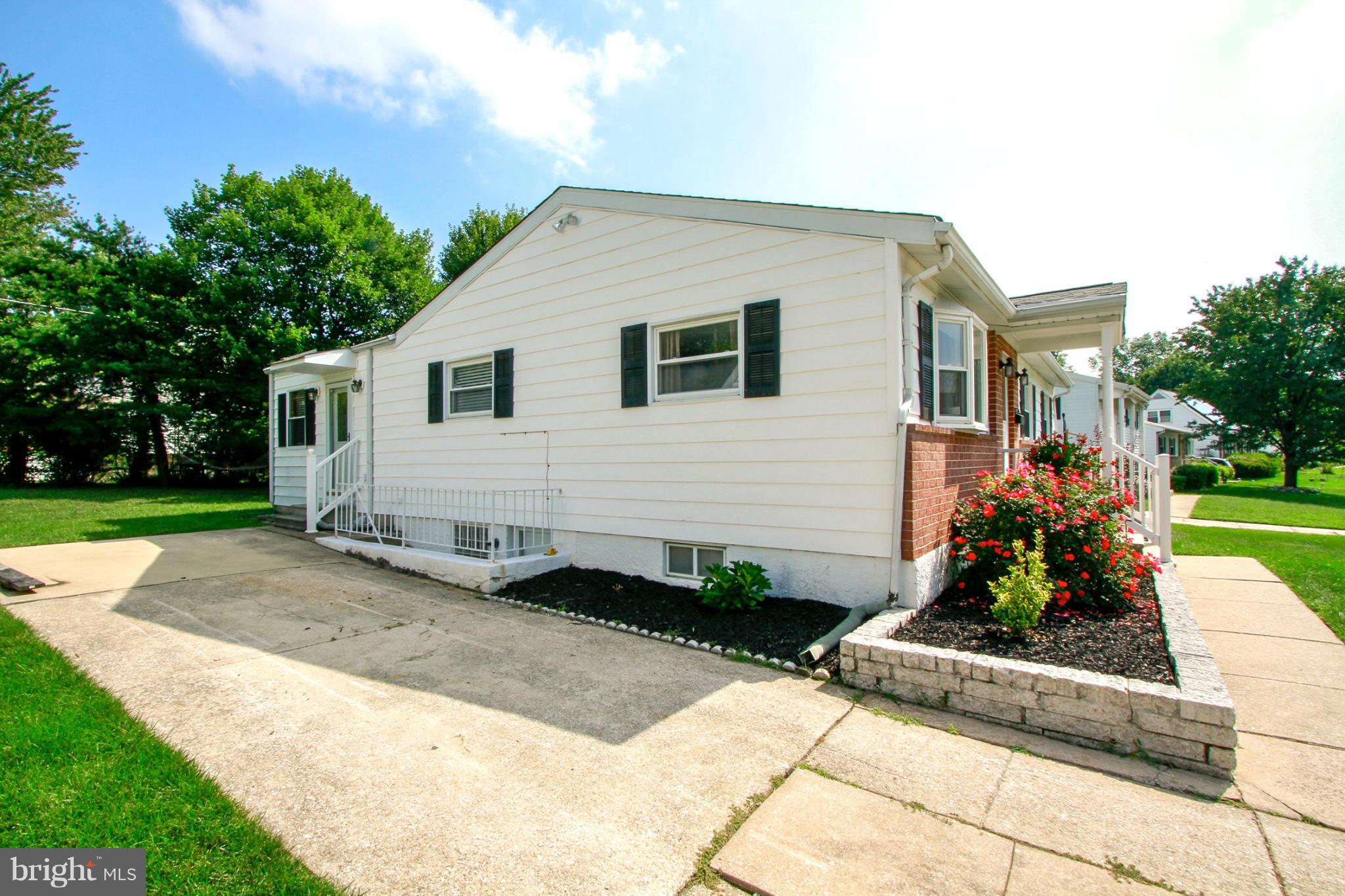 6202 Collinsway Road Baltimore, MD 21228 - Photo 29 of 30 a front view of a house with garden