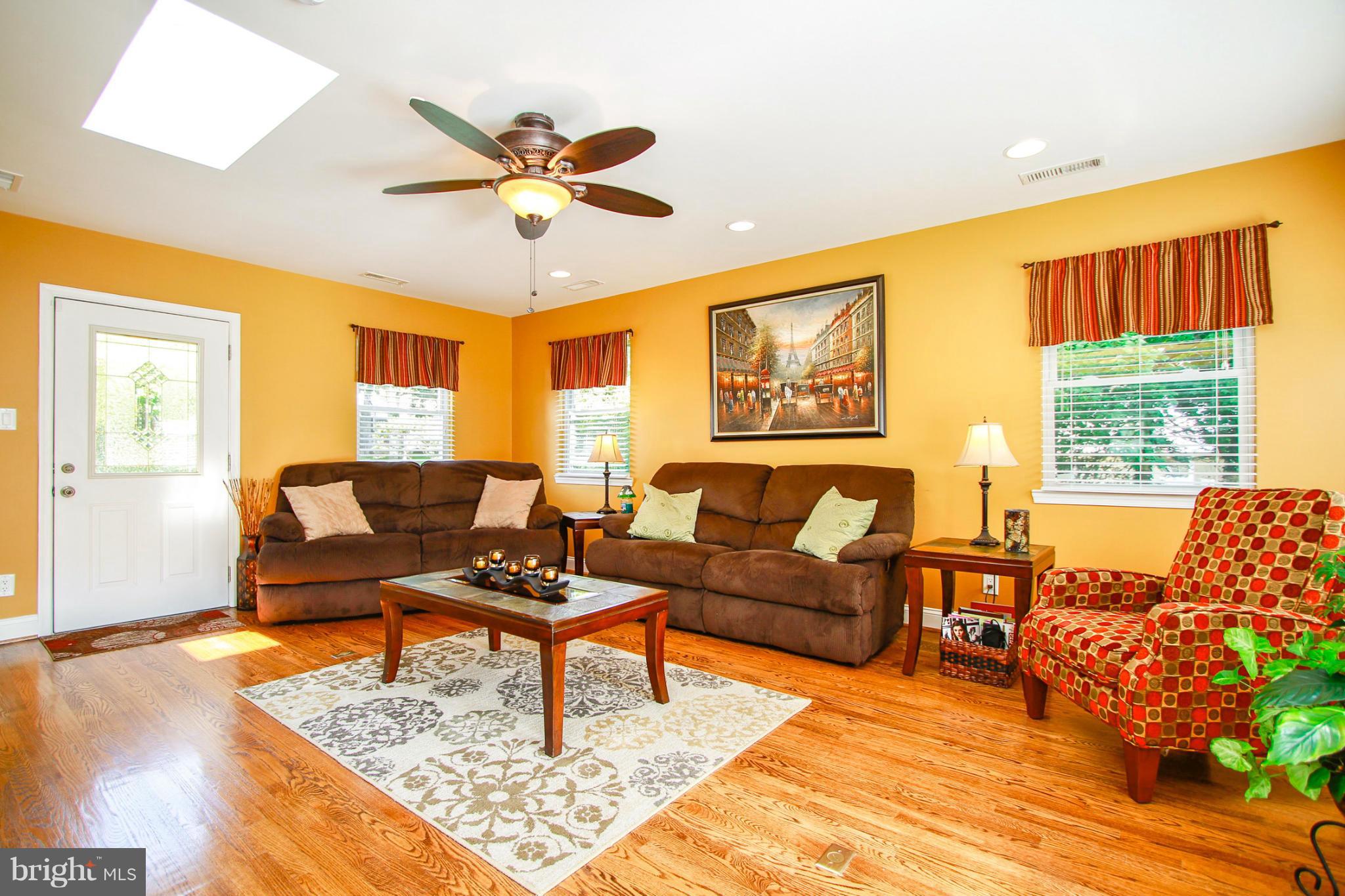 6202 Collinsway Road Baltimore, MD 21228 - Photo 10 of 30 a living room with furniture and a large window