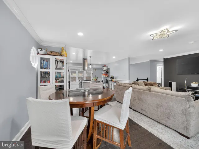 a view of a dining room with furniture and a table