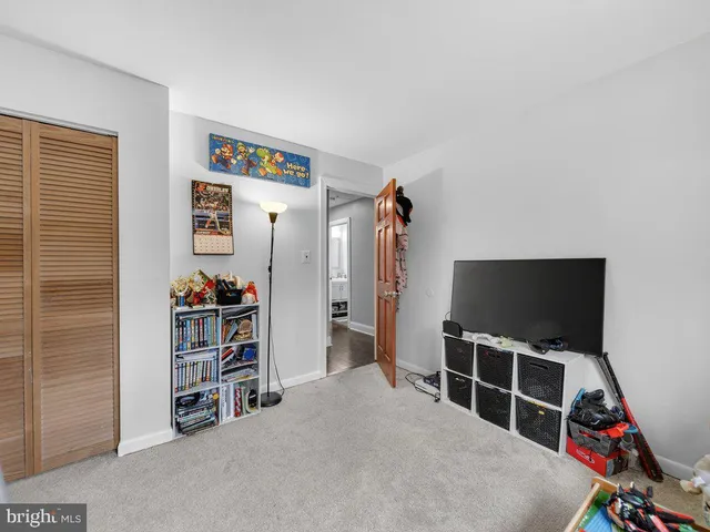 a room with furniture and a flat screen tv