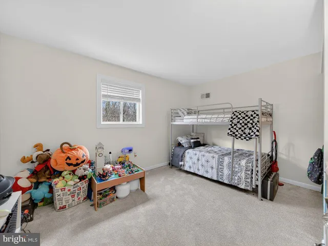 a bedroom with furniture and a lounge chair