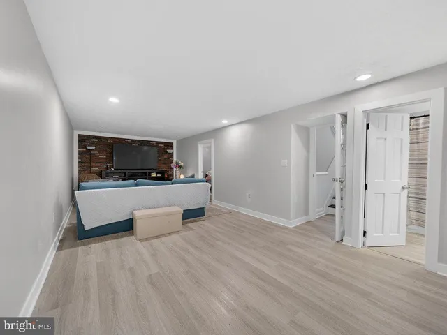 a view of kitchen with refrigerator microwave and stove