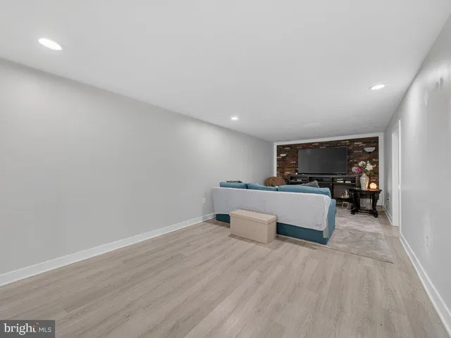 a view of kitchen with furniture and refrigerator