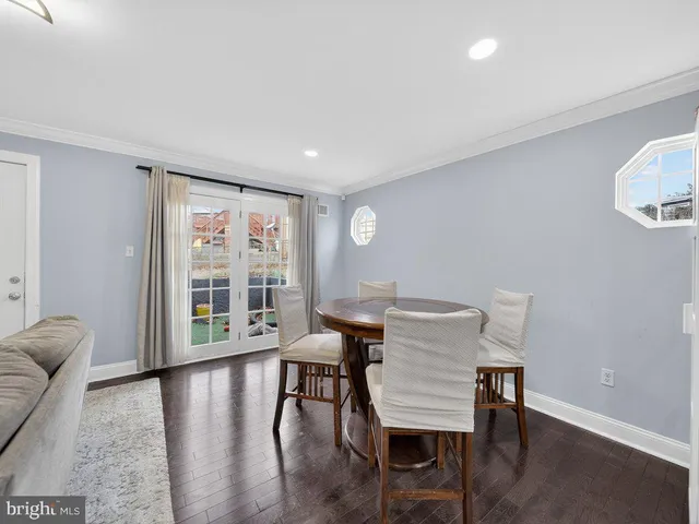 a view of a livingroom with furniture window and wooden floor