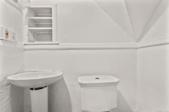 a bathroom with a sink and a toilet
