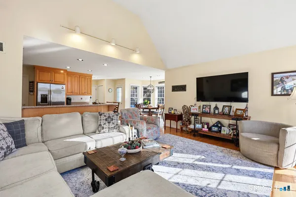 a living room with furniture and a flat screen tv