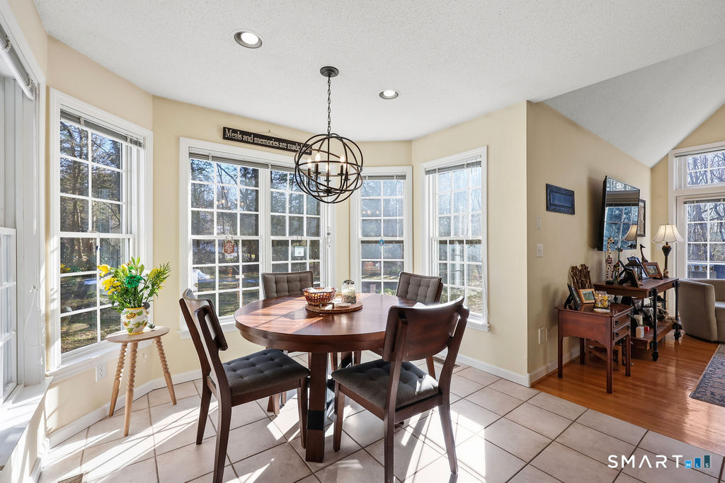 73 High Valley Drive Canton, CT 06019 - Photo 19 of 37 a view of a dining room with furniture window and outside view