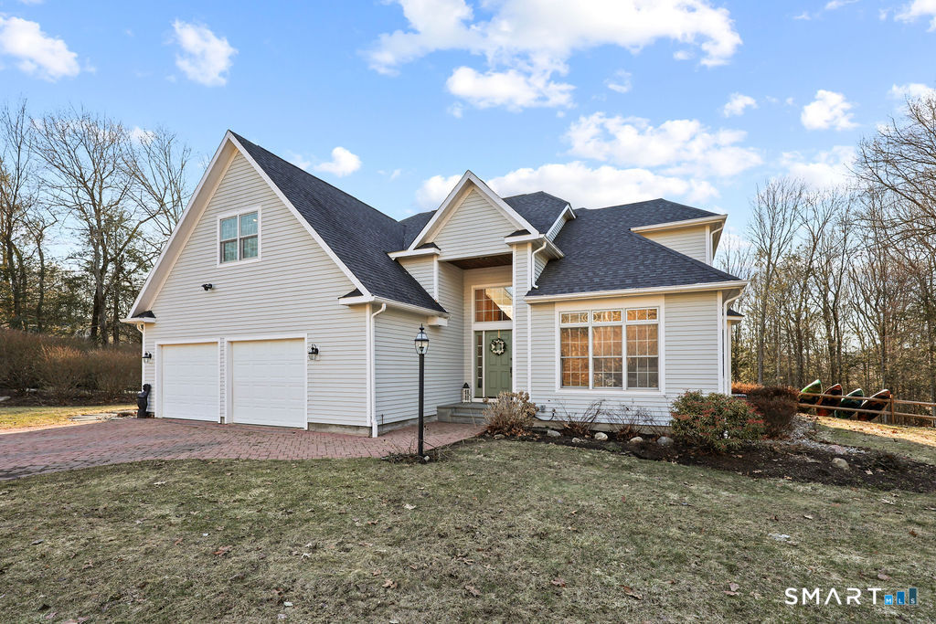 73 High Valley Drive Canton, CT 06019 - Photo 2 of 37 a view of front of a house with a yard