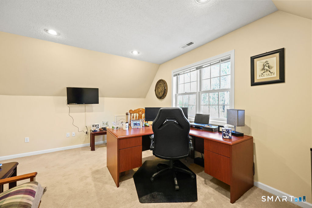 73 High Valley Drive Canton, CT 06019 - Photo 28 of 37 a workspace with furniture and window
