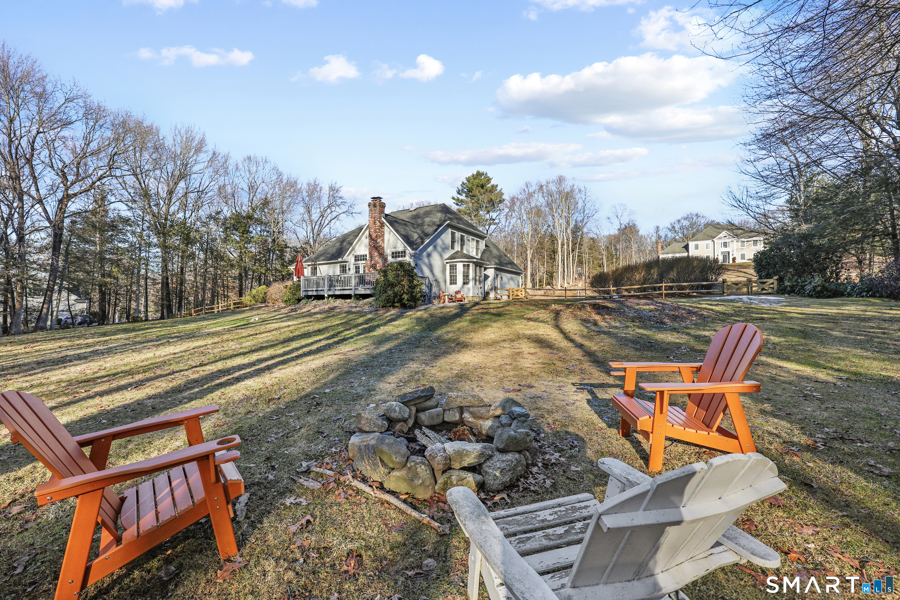 73 High Valley Drive Canton, CT 06019 - Photo 4 of 37 a backyard of a house with table and chairs