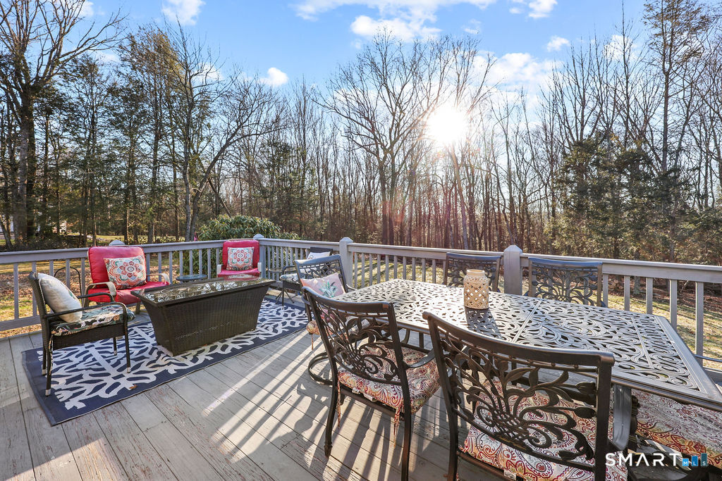 73 High Valley Drive Canton, CT 06019 - Photo 5 of 37 a balcony with wooden floor table and chairs