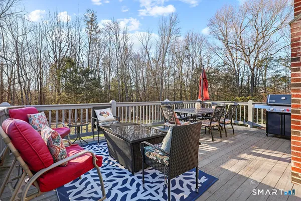 a view of balcony with outdoor seating and city view