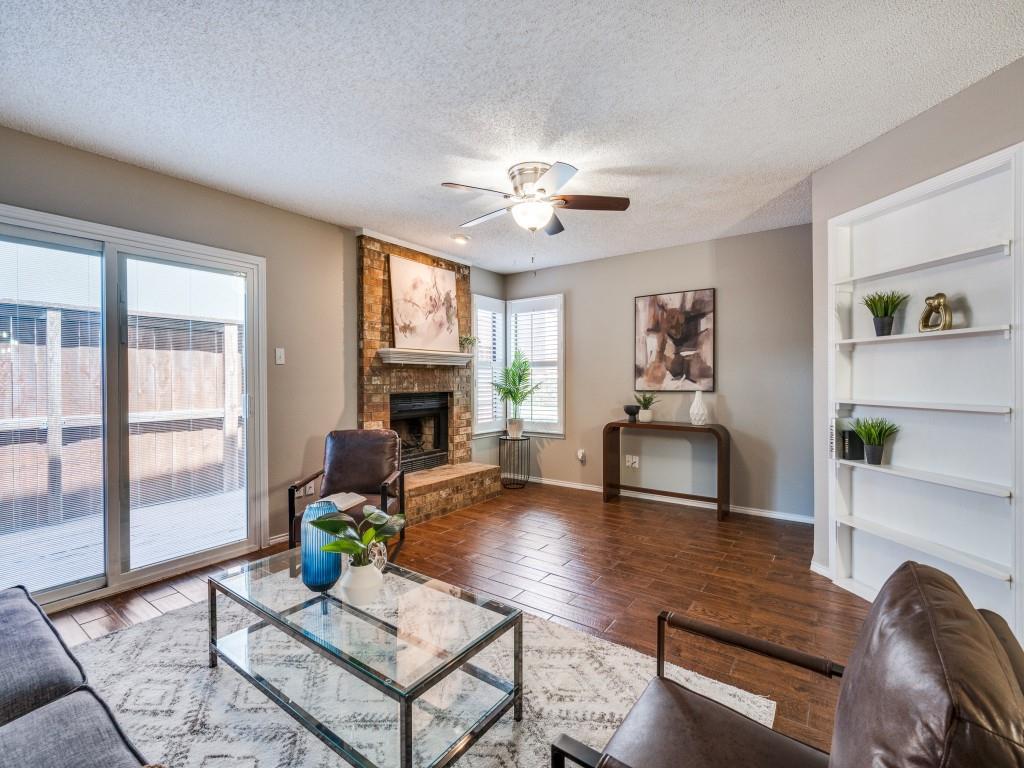 46 Morrow Drive Bedford, TX 76021 - Photo 1 of 25 a living room with furniture a fireplace and a table