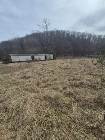 a blue bench sitting in front of a blue wall