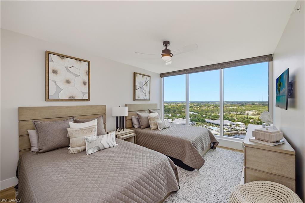13925 Old Coast Road, Unit 1706 Naples, FL 34110 - Photo 22 of 37 a bedroom with a bed couch and window