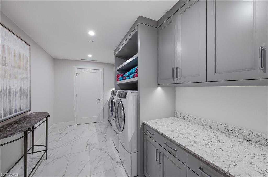 13925 Old Coast Road, Unit 1706 Naples, FL 34110 - Photo 24 of 37 a utility room with cabinets