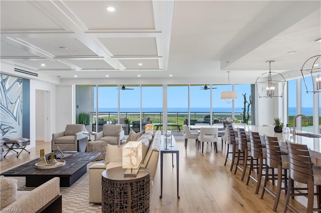 13925 Old Coast Road, Unit 1706 Naples, FL 34110 - Photo 3 of 37 a view of a dining room with furniture window and outside view
