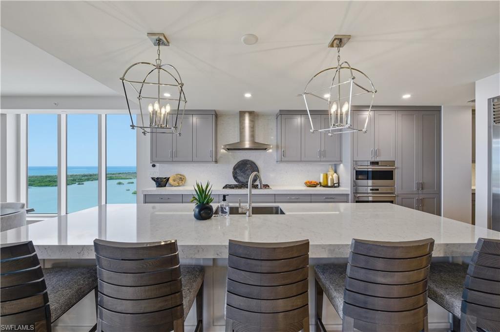 13925 Old Coast Road, Unit 1706 Naples, FL 34110 - Photo 8 of 37 a kitchen with counter top space and appliances