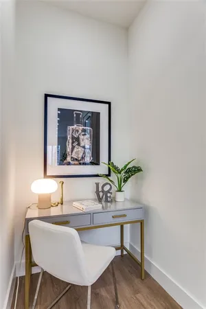 a workspace with furniture and a potted plant