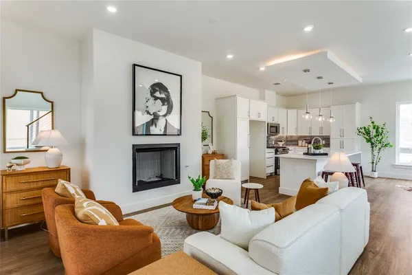 a living room with furniture potted plant and a fireplace
