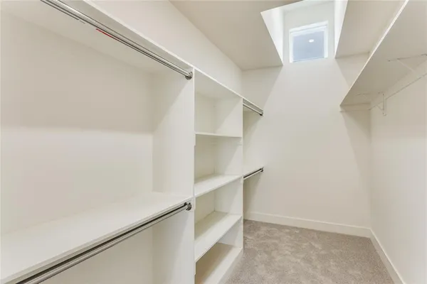 a view of an empty walk in closet