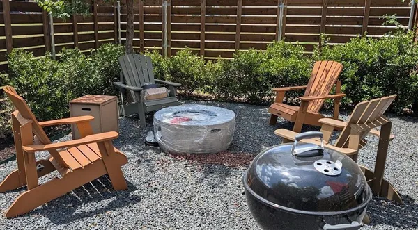 a view of a chairs and table in the patio