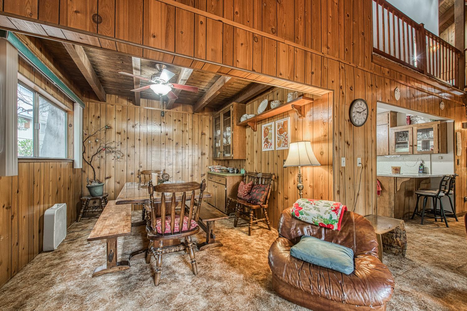 42303 Hanging Branch Road Shaver Lake, CA 93664 - Photo 12 of 39 a view of a chairs and table in the balcony