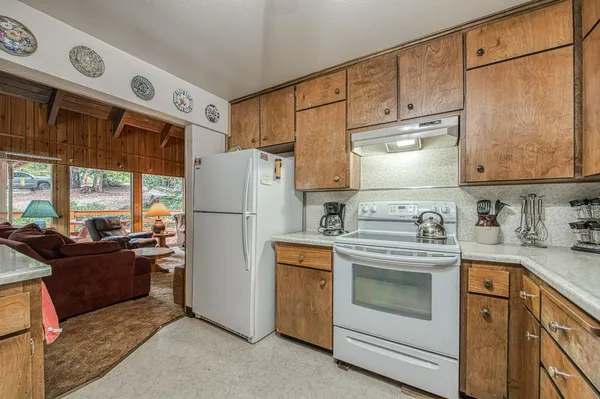 a utility room with faucet washer and dryer