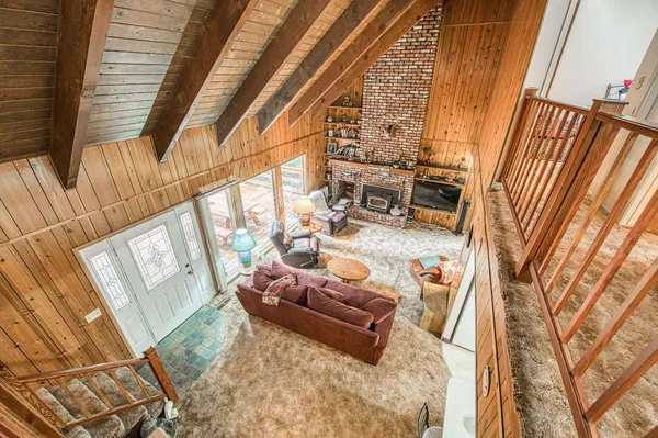 a room with pool table and a rug